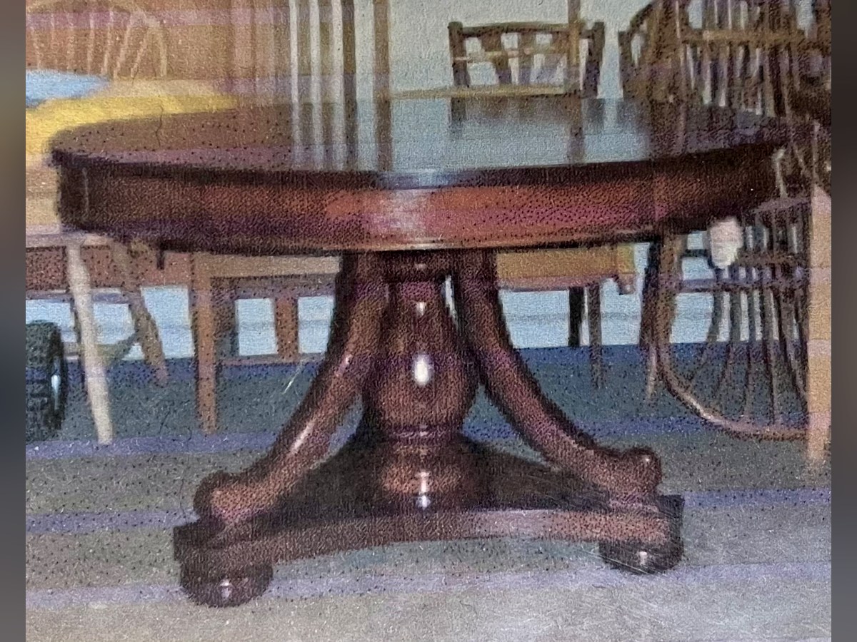 Custom solid mahogany round pedestal entryway table with a carved column base and four curved feet, hand-built by David Shutt