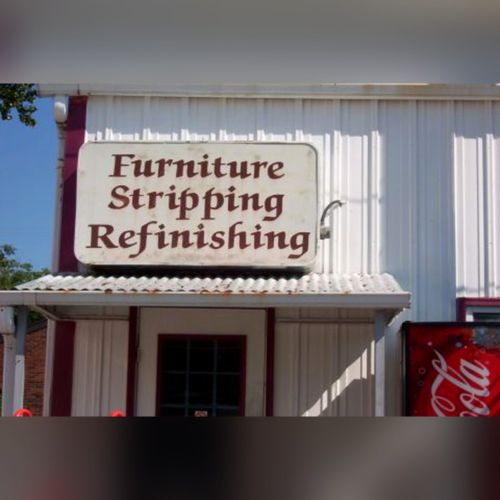 Original hand-painted "Furniture Stripping Refinishing" sign made by Nancy Shutt, still hanging at the Doll Furniture Company shop in Normal, Illinois