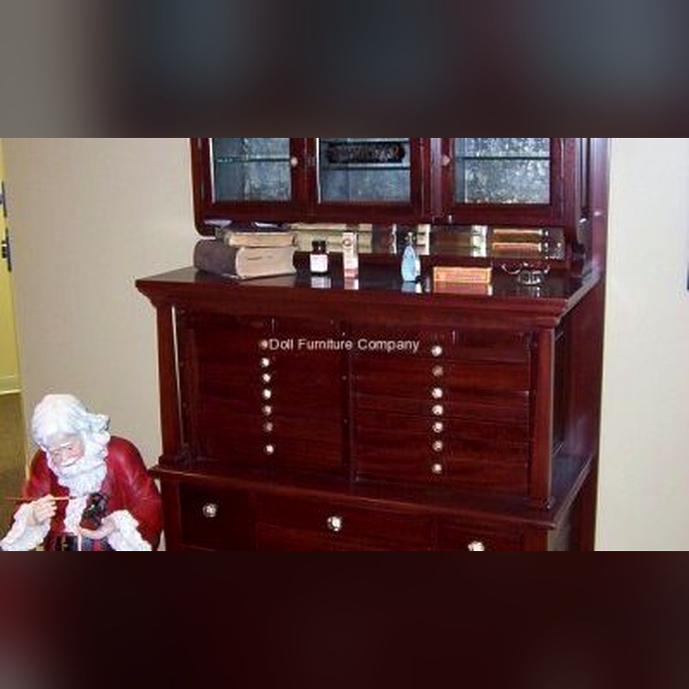 Antique dentist cabinet refinished in rich mahogany by Doll Furniture Company — now on display at a dental office in Bloomington, Illinois